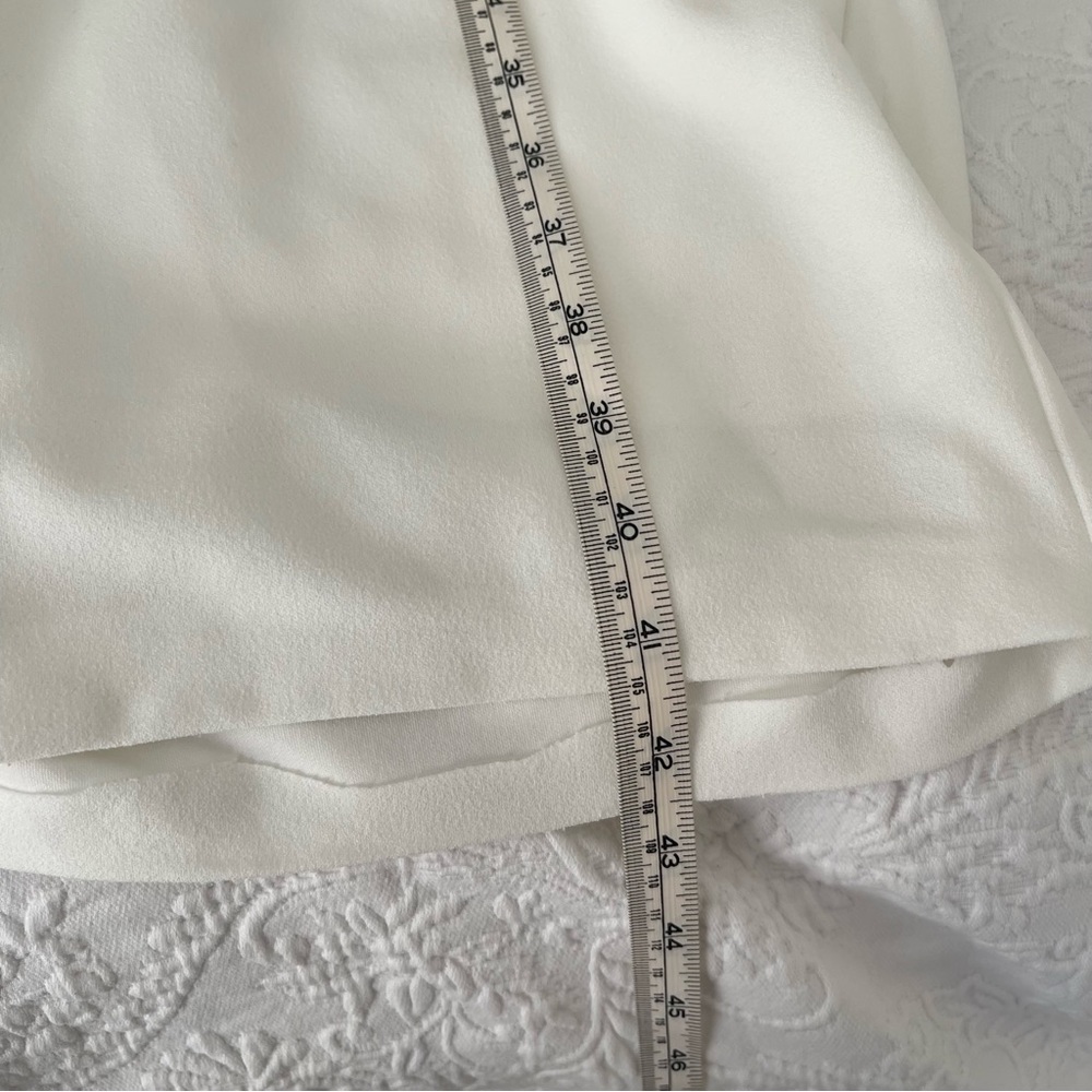 With A Puff Lulus white jumpsuit - Picture 9 of 9